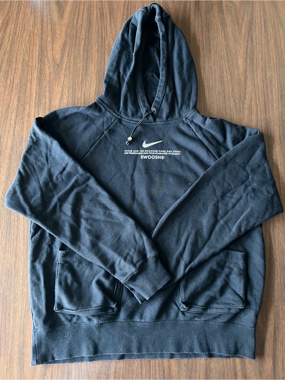 Nike Black Pullover Hoodie with White Swoosh and Text